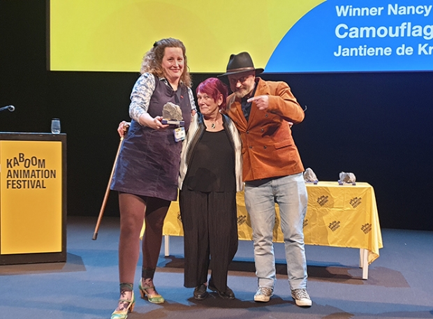Jantiene de Kroon, Remco Polman and Nancy with their "Nancy Award"